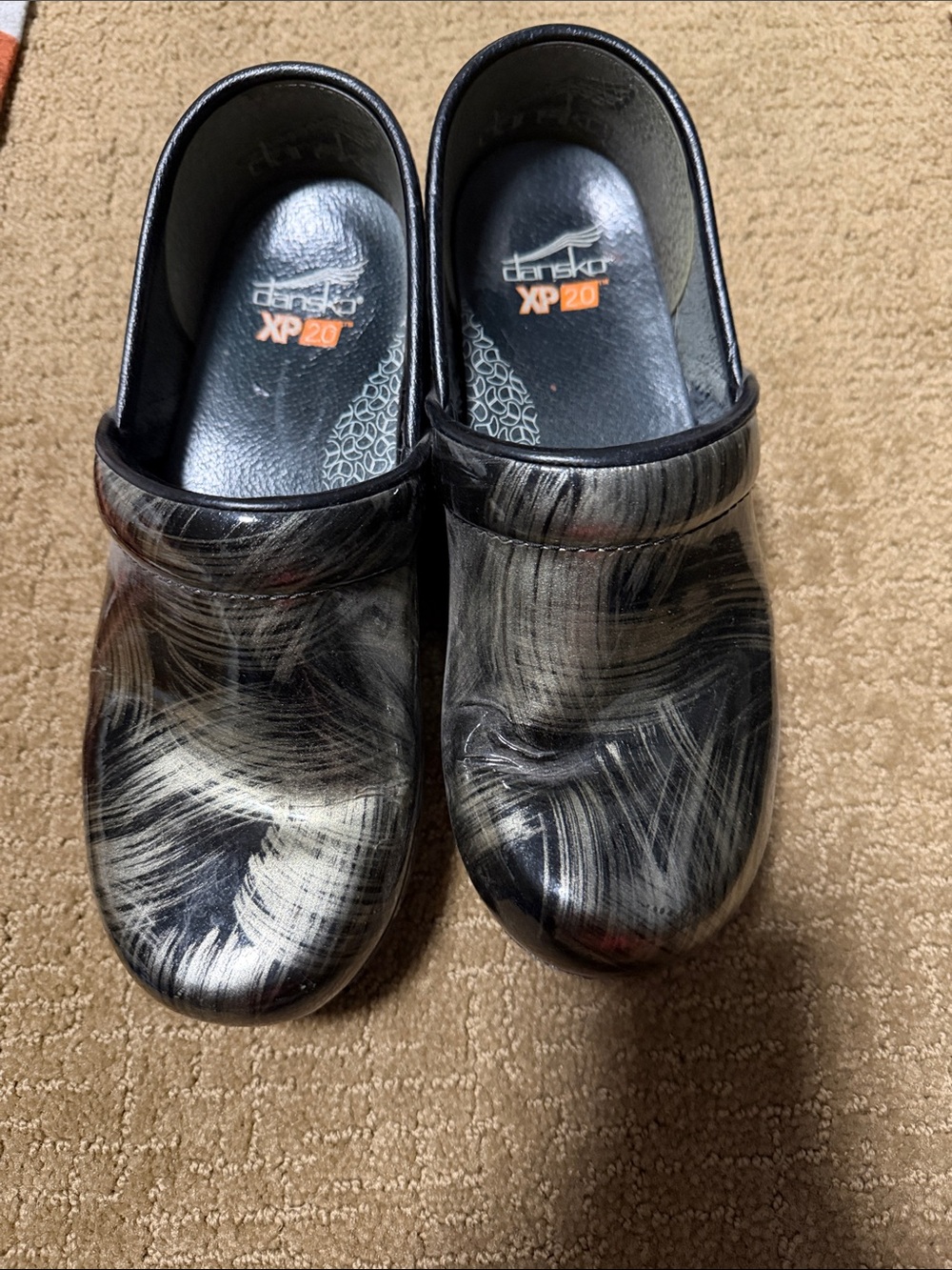 Dansko Black and White Marbled Slip-On Clogs